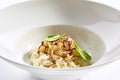 Risotto with roasted pear and almond closeup