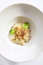 Risotto with roasted pear and almond top view