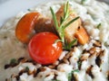 Risotto with seafood, cherry tomatoes and balsamic vinegar