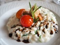 Risotto with seafood, cherry tomatoes and balsamic vinegar