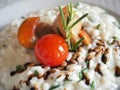Risotto with seafood, cherry tomatoes and balsamic vinegar