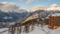 Risoul resort buildings, French alps in winter, snowy mountains in France