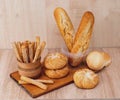 ÃÂ¡risp bread with buns. French baguettes. Fresh crispbread. Bread background. Different breed on wooden background