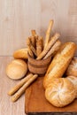 ÃÂ¡risp bread with buns. French baguettes. Fresh crispbread. Bread background. Different breed on wooden background