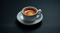 Ristretto coffee in a white cup, the essence of a coffee break on a dark background