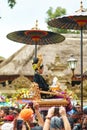 Rite of cremation of the royal family on the island of Bali. Topla people carry the throne with the members of the royal family