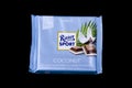 Ritter Sport chocolate bar isolated on dark background. Royalty Free Stock Photo