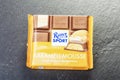 Ritter Sport chocolate bar isolated on stone slate background. Royalty Free Stock Photo