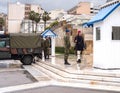 The ritual of changing the guard of Greek Evzonian Guards at the grave of the Unknown Soldier on Syntagma Square in rainy weather