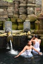 Ritual purifying bath in the temple pond. Tirta Empul. Tampaksiring. Gianyar regency. Bali. Indonesia