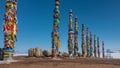 Ritual wooden pillars, tied with bright multi-colored ribbons