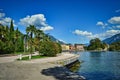 Riva del Garda, Italy- garda lake with pro, bmenade, palms, peaks, town, beach, shore, blue sky Royalty Free Stock Photo