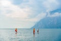 Riva del Garda, Italy - September 22, 2021: Athletes practice windsurfing at a surf academy near the lake