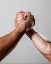 Rivalry, closeup of male arm wrestling. Muscular men measuring forces, arms. Hand wrestling, compete. Hands or arms of Royalty Free Stock Photo