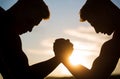 Rivalry, vs, challenge, hand wrestling. Sunset, sunrise. Rivalry, closeup of male arm wrestling. Men measuring forces