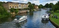 The rive Ouse at St Neots with river cruisers and waterside properties.