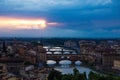 River Arno with bridge Ponte Vecchio in the evening view from Piazzale Michelangelo. Dramatic sunset dark blue sky. Royalty Free Stock Photo