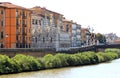 River Arno and gothic church in Pisa, Italy