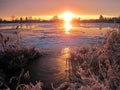 River Atmata, homes and plants in winter, Lithuania