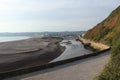 The river Axe near Seaton in Devon curves round a sandbank just before entering the sea Royalty Free Stock Photo