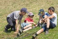 River Ay, Republic of Bashkortostan 09-05-2019: Four boys sit on the grass and prepare for fishing
