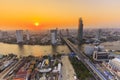 River in Bangkok city with high office building at sunset