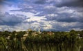 On the river bank, on top of the hill, are two white towers. Royalty Free Stock Photo