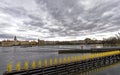 A river barrier lined with tiny yellow penguins against a beautiful landscape background