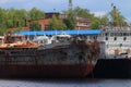 River bay with rusty cargo ships Royalty Free Stock Photo