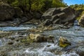 The river bed of the Alcantara river is littered with large volcanic boulders near Taormina, Sicily Royalty Free Stock Photo