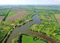 The river branches into two streams. Aerial image above the village Royalty Free Stock Photo