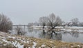 River, bridge, home and beautiful white trees in frost, Lithuania Royalty Free Stock Photo