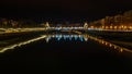 River with a bridge with street light reflected on it at night in San Sebastian, Spain Royalty Free Stock Photo