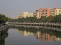 River, building, trees and reflection at Zhuhai