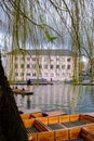 River Cam in Cambridge, England with moored punts at the shore Royalty Free Stock Photo