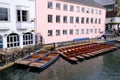 River Cam in Cambridge, England with moored punts at the shore Royalty Free Stock Photo