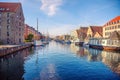 Canal with many boats and ships with small old houses in the  neighbourhood area Christianshavn in Copenhagen, Denmark Royalty Free Stock Photo