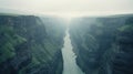 Misty Canyon: A Captivating Photo Of A River Flowing Through Mountains