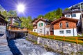 River and chalet in swiss village in Alps, Leukerbad, Leuk, Visp Royalty Free Stock Photo