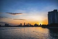 River city view landscape at twilight sunset. Boat on river with tranquil water. Hochiminh city Saigon vietnam cityscape building Royalty Free Stock Photo