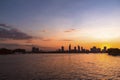 River city view landscape at twilight sunset. Boat on river with tranquil water. Hochiminh city Saigon vietnam cityscape building Royalty Free Stock Photo