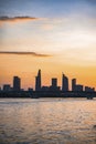 River city view landscape at twilight sunset. Boat on river with tranquil water. Hochiminh city Saigon vietnam cityscape building Royalty Free Stock Photo