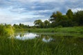 River and cloudy sky on summer evening Royalty Free Stock Photo