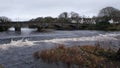 River Cree flowing over the weir at the Cree Bridge in Newton Stewart in winter