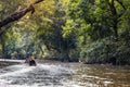 River cruise along scenic Tahan River with lush rainforest foliage at Taman Negara National Park, Pahang