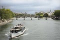 River Cruises sailing bring travelers passengers tour Paris city at riverside of Seine river