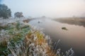 River curve covered in light hoarfrost in autumn