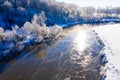 River curve on sunny morning in winter, aerial landscape. Temperature contrast concept