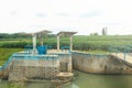 river dam with iron irrigation sluice gates