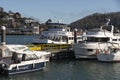 River Dart, Dartmouth, Devon a tourist excursion boat arriving on a jetty.